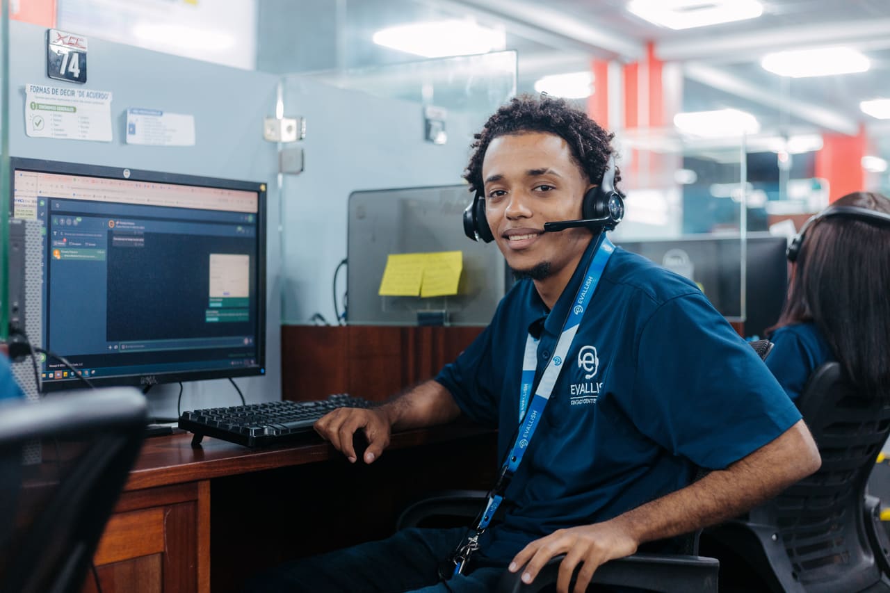 Agent smiling at his workstation